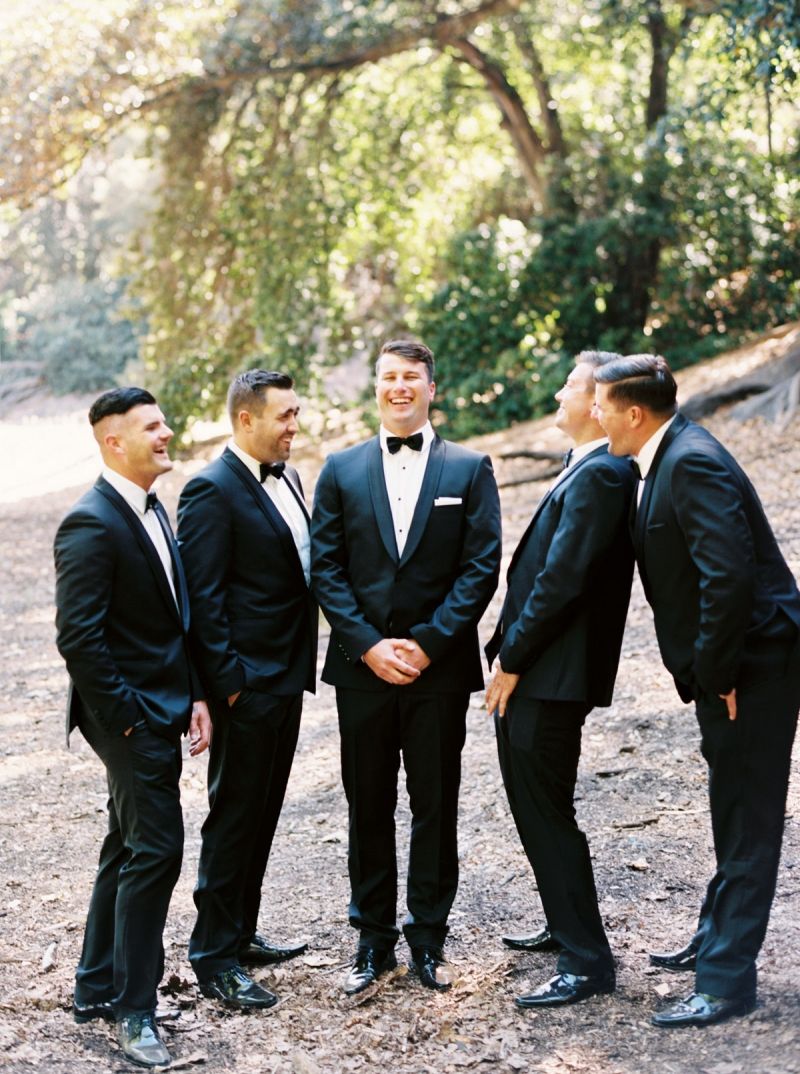 Grooms in black suits