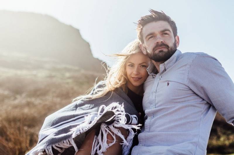 Windswept coastal engagement shoot at sunrise