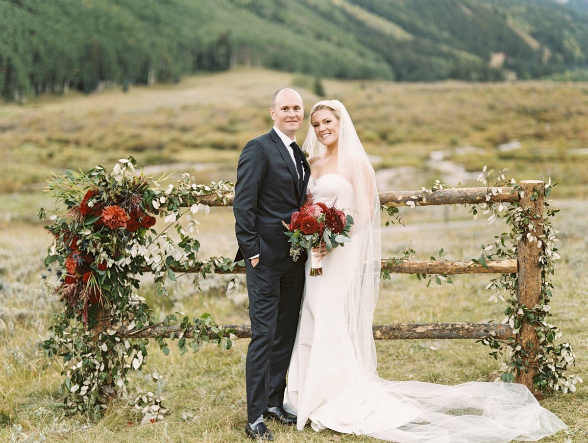 Aspen mountain wedding with stunning red florals