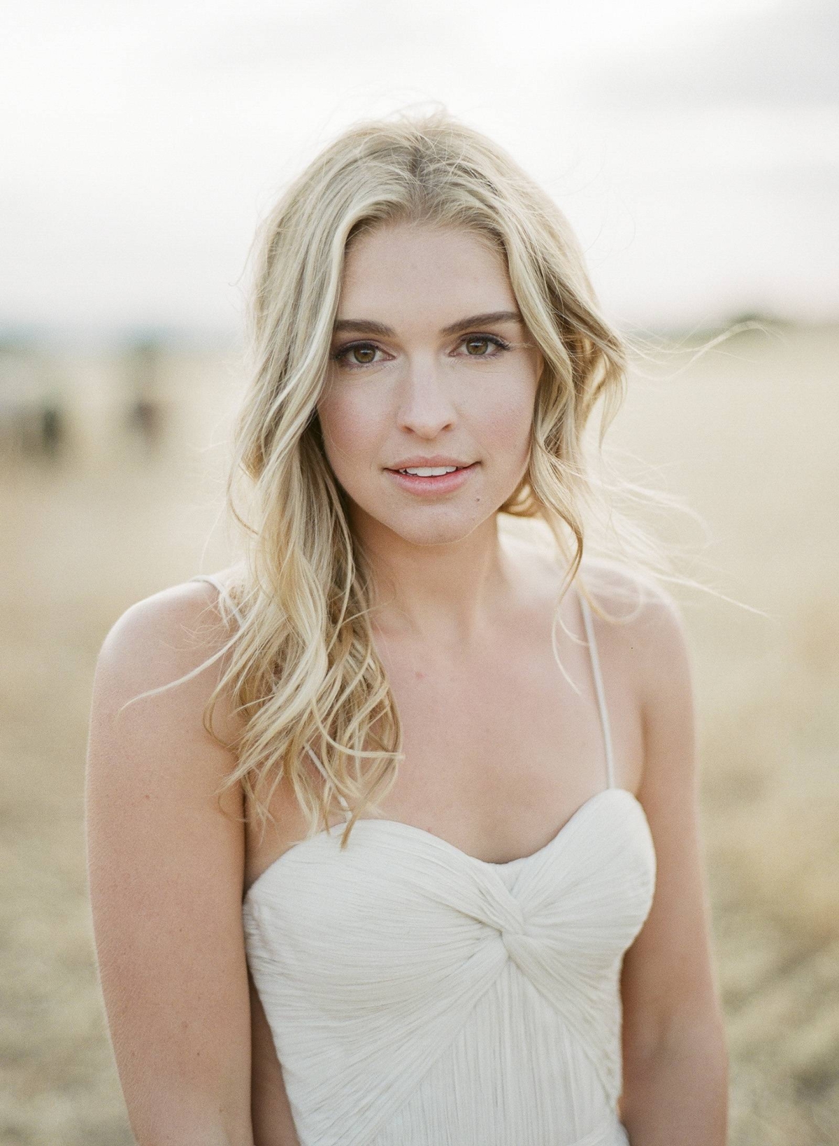 Stunning bridal shoot amongst wild horses and golden wheat fields