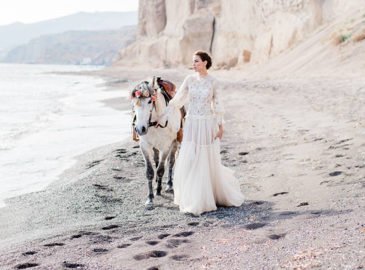 Romantic Santorini beach Wedding Inspiration with a dramatic beach backdrop