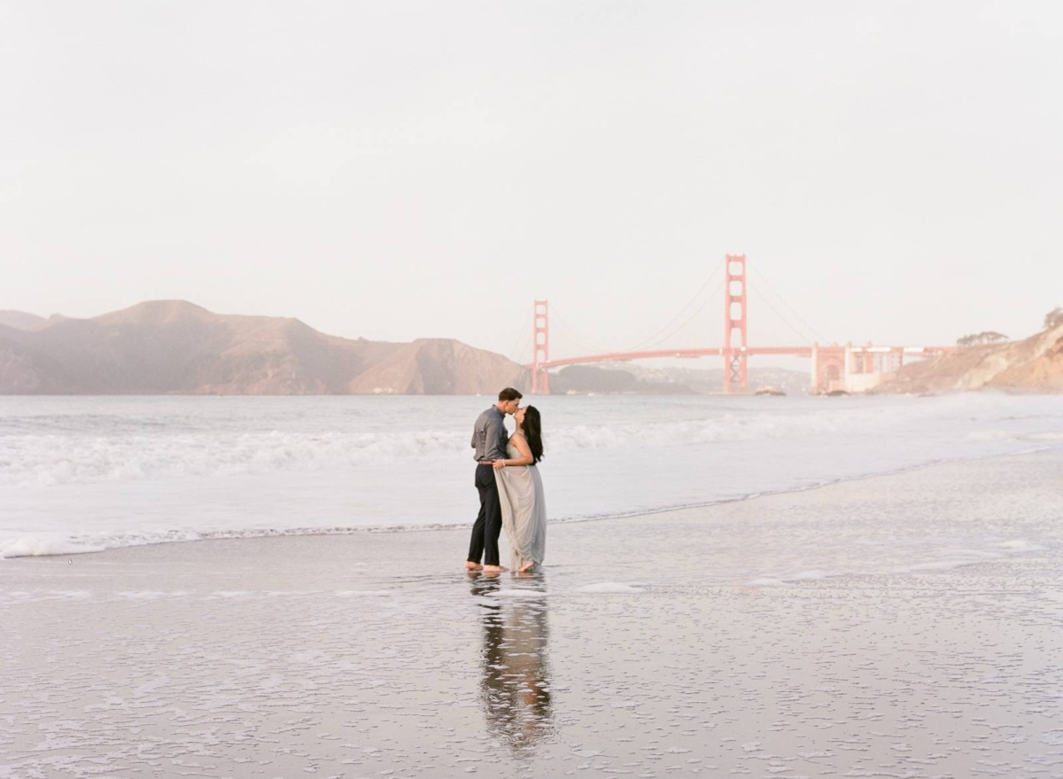 A relaxed and playful engagement session in front of Golden Gate Bridge