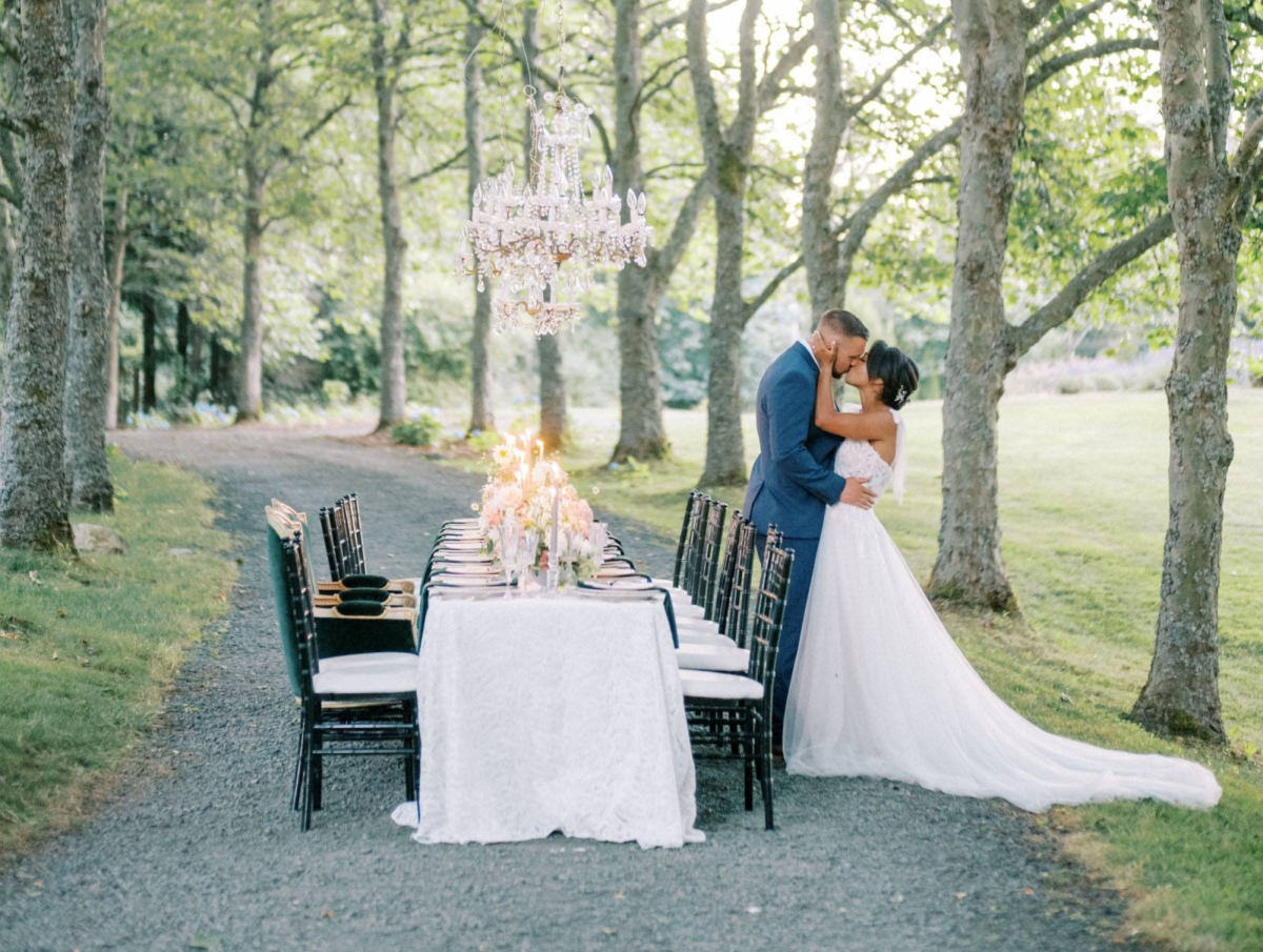 Outdoor wedding inspiration with an al fresco dinner under a tree-lined avenue