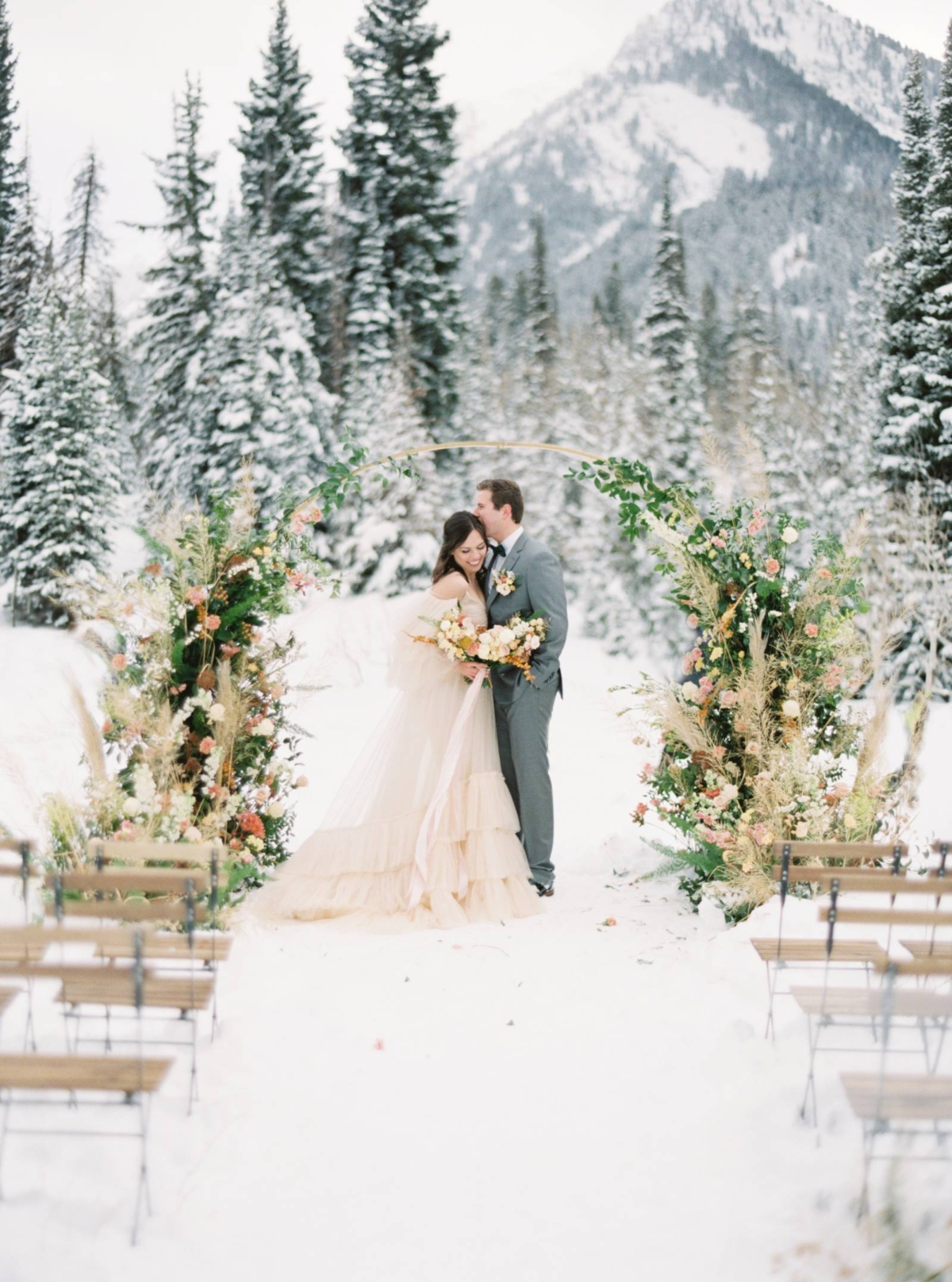 Romantic snowy ceremony on a stunning Utah mountain top