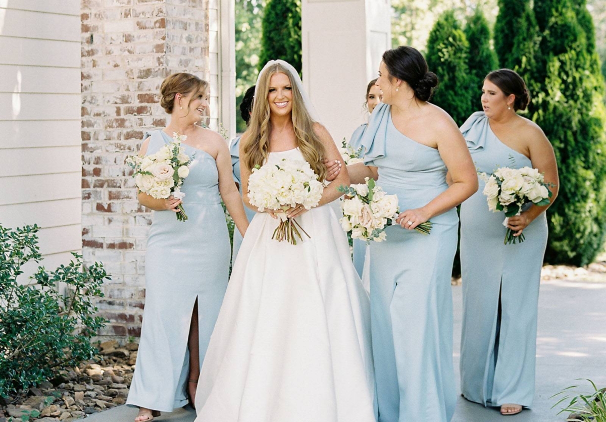 A beautiful Garden Wedding in Arkansas with bridesmaids in blue