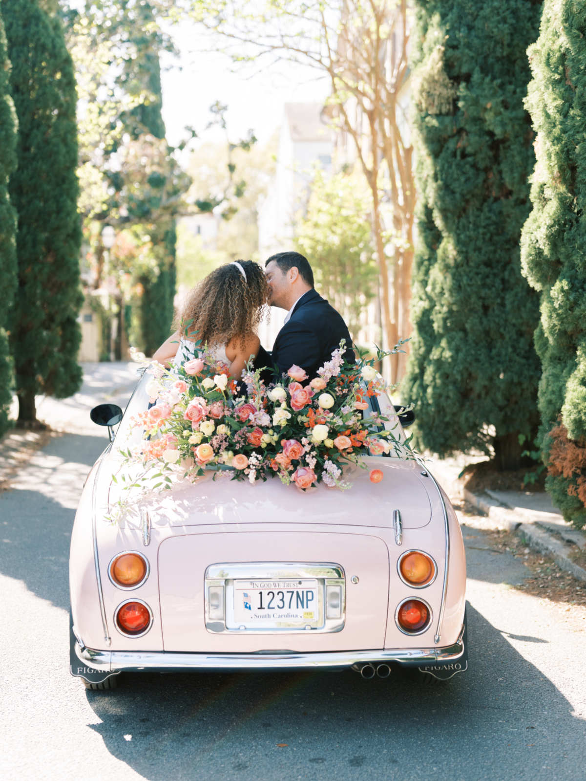 A stylised Charleston engagement session with the cutest vintage pink car